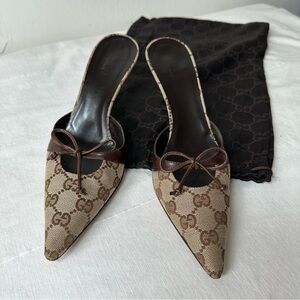 GUCCI 

Guccissima Signature ‘GG’ Mules in leather and canvas